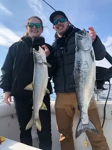 Two chinook salmon being caught while fishing in Minnesota
